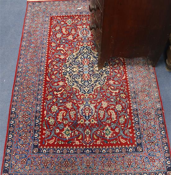 A Tabriz silk red medallion rug (moth damaged) 110 x 170cm